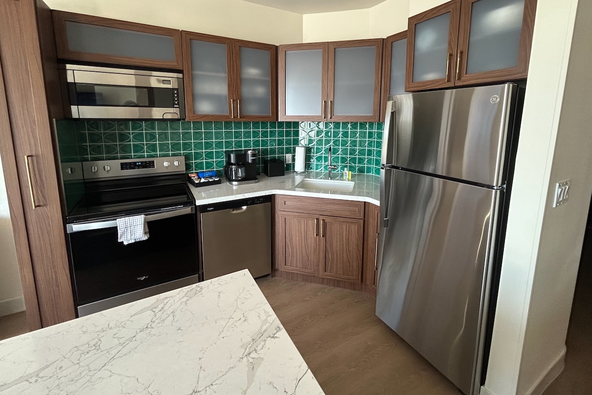 Full kitchen with range, refrigerator, microwave