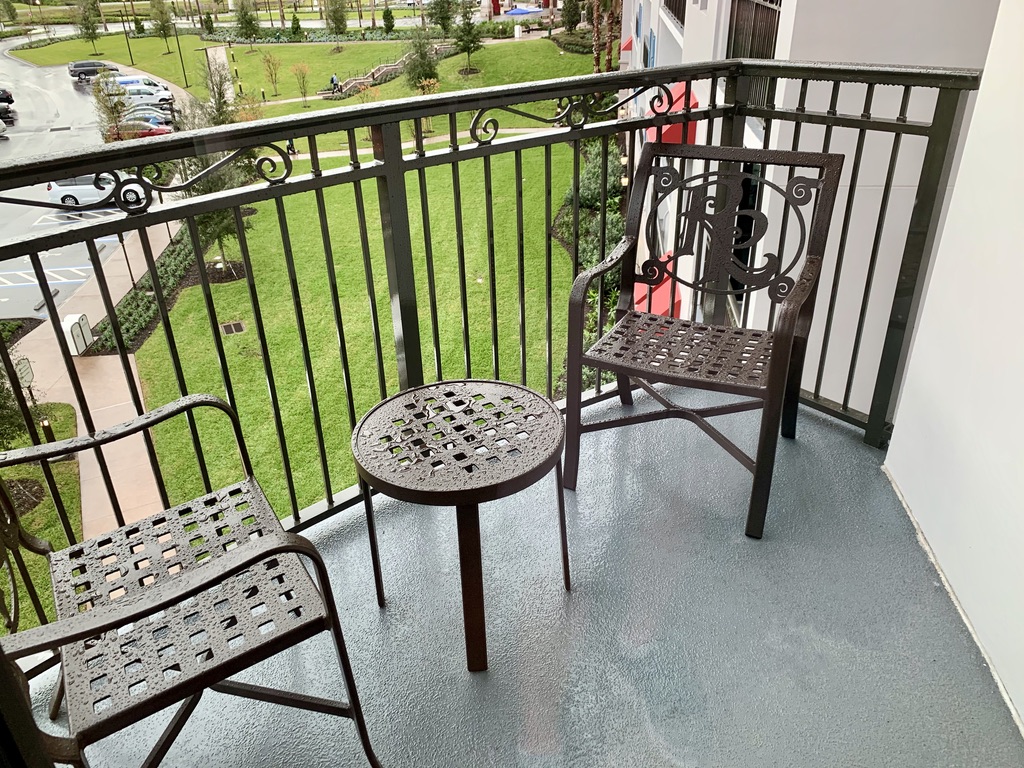 Balcony with table and two chairs