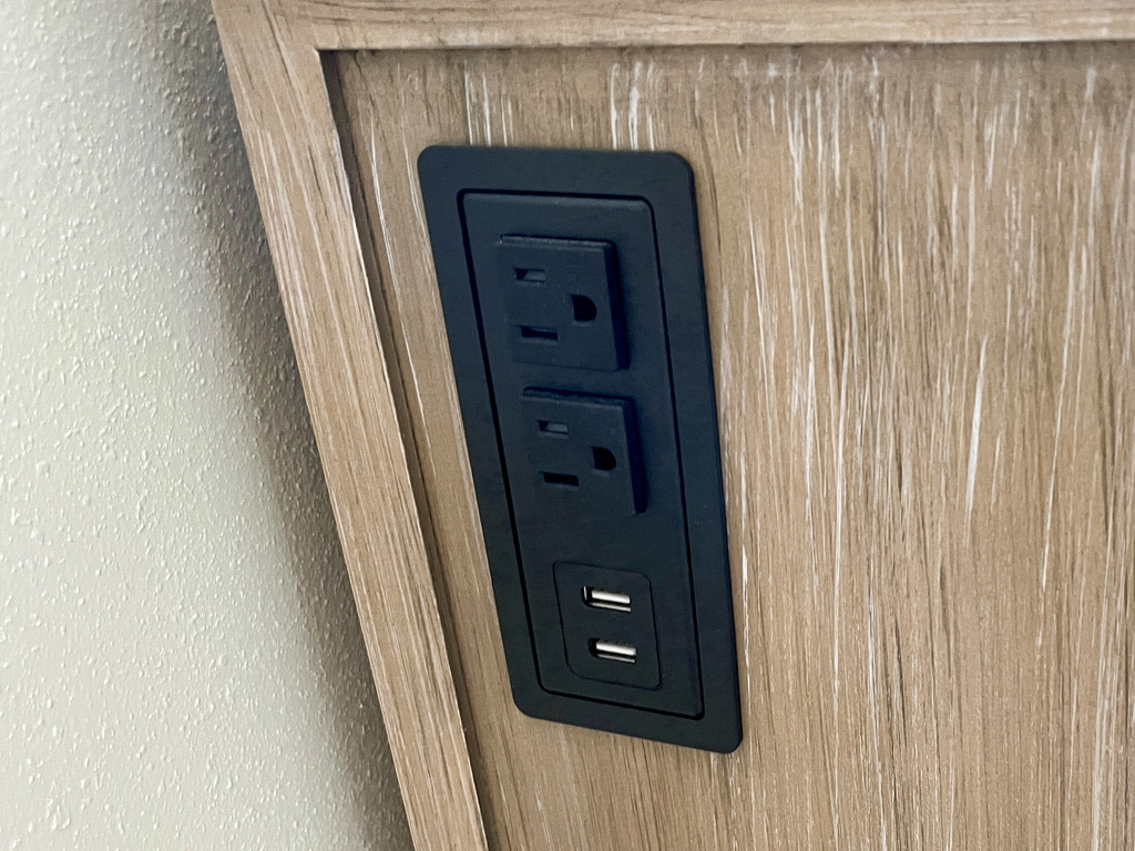Electric and USB ports on dresser