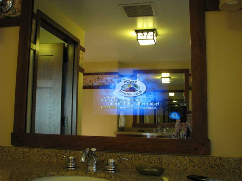 Television embedded in master bath mirror
