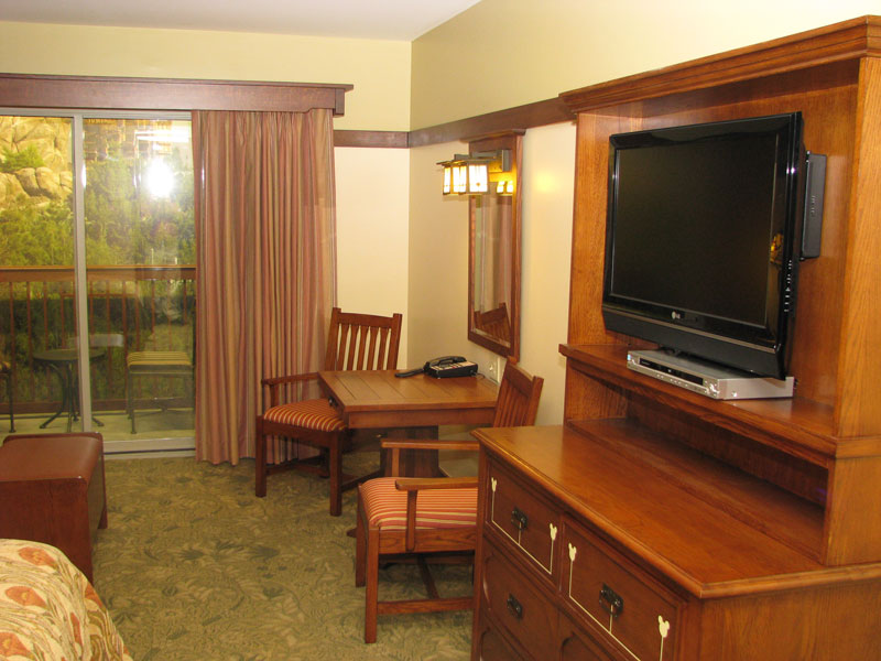 TV, dresser, side table with two chairs