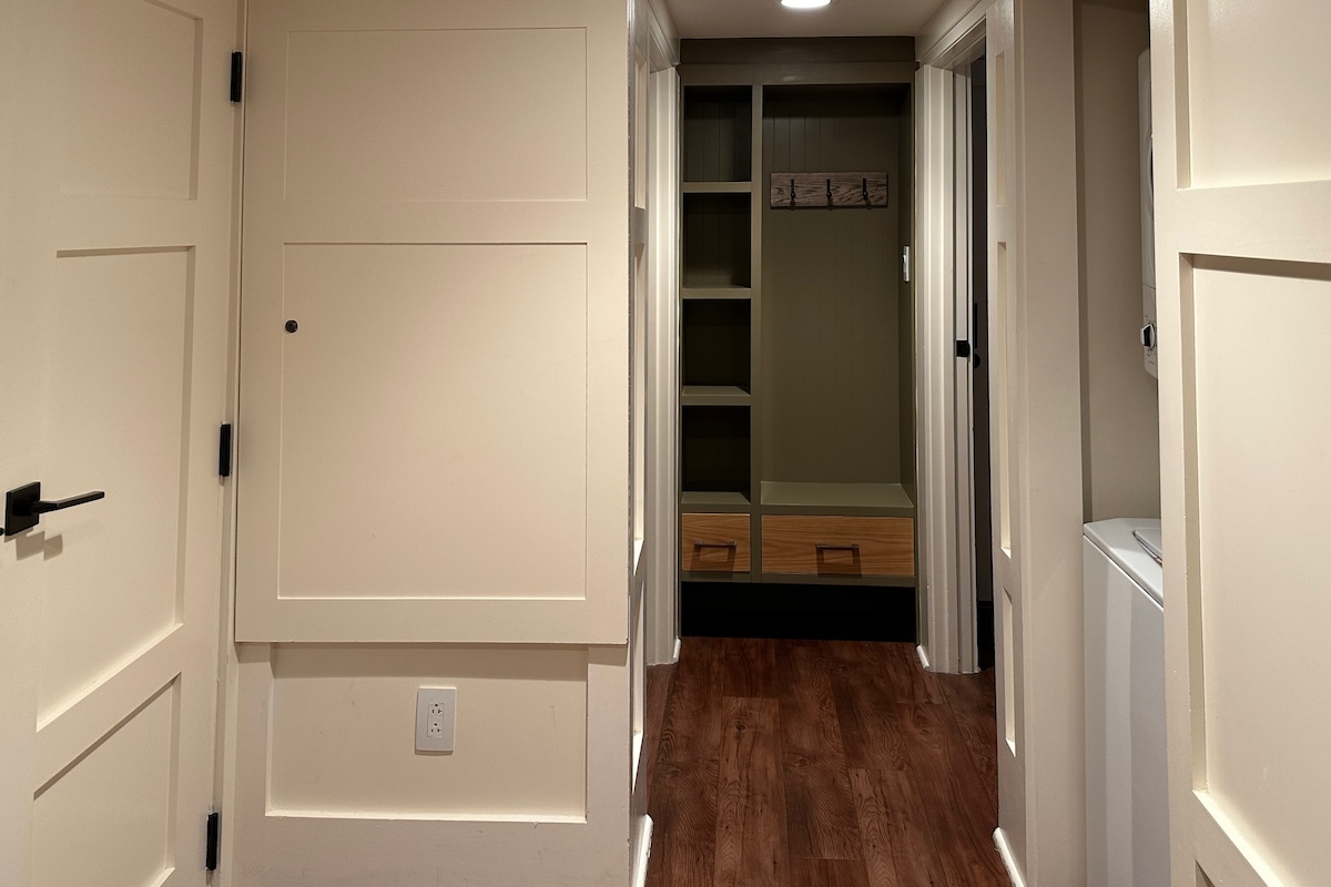 Hallway with storage cubby near master suite